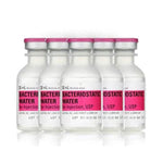 A lineup of five 30ml Bacteriostatic Water bottles for injection, each featuring a pink label and cap, are infused with benzyl alcohol for sterility and safe storage. Sold under the Henry Schein brand in a 25-pack, the price is set to rise from $77.75 to $87.50 on 1/15/25.
