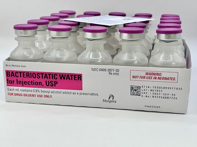 Five bottles of Henry Schein 30ml Bacteriostatic Water are arranged in a row, each featuring a pink and white label and a pink cap.